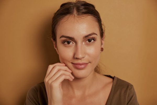 Beautiful woman in yellow background